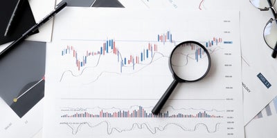 Image of a graph and magnifying glass